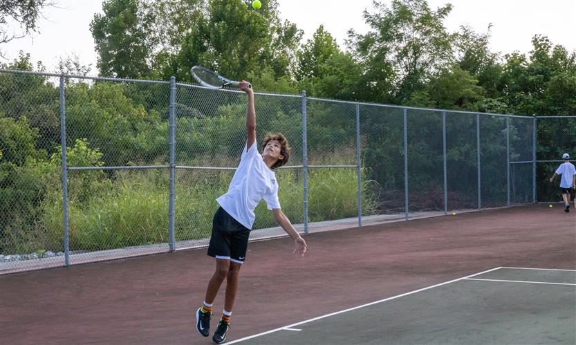 A tennis player hits the ball